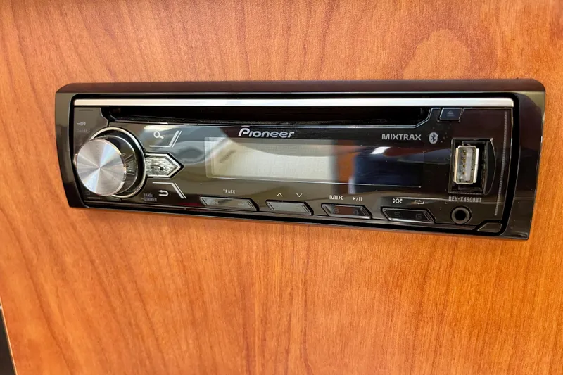 Slide: The Image of Pioneer Mixtrax stereo system in 2008 Bayliner 265 boat, featuring USB and Bluetooth connectivity. - 24