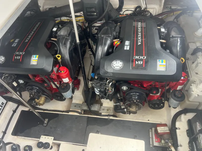 Slide: The Image of Two Volvo Penta V8 engines in the engine room of a 2013 Chaparral 330 Signature boat. - 18