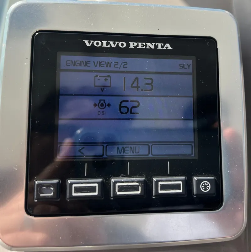 Slide: The Image of A Volvo Penta engine display screen shows 14.3 volts and 62 psi. - 27