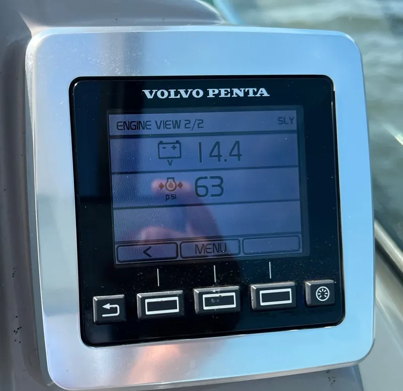 Slide: The Image of A Volvo Penta engine control display shows 14.4 volts and 63 PSI. - 28