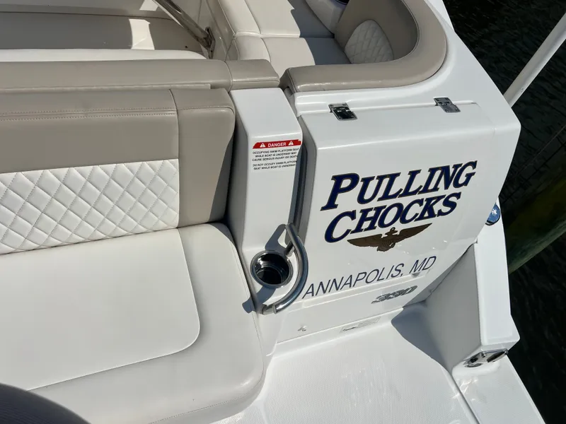 Slide: The Image of The image shows the stern of a boat named "Pulling Chocks" from Annapolis, MD. - 30
