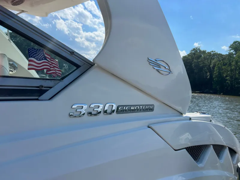 Slide: The Image of Close-up of Chaparral 330 Signature with American flag and water in the background. - 33