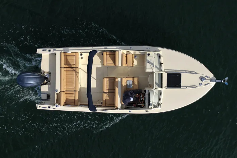 Slide: The Image of Overhead view of 2027 Rossiter 23 Closed Deck boat cruising on water. - 15