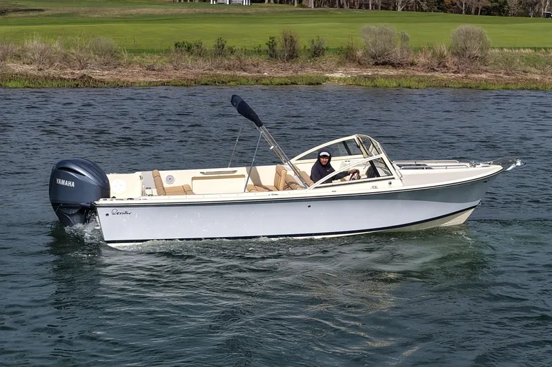 Slide: The Image of 2027 Rossiter 23 Closed Deck boat cruising on a lake with Yamaha engine. - 3