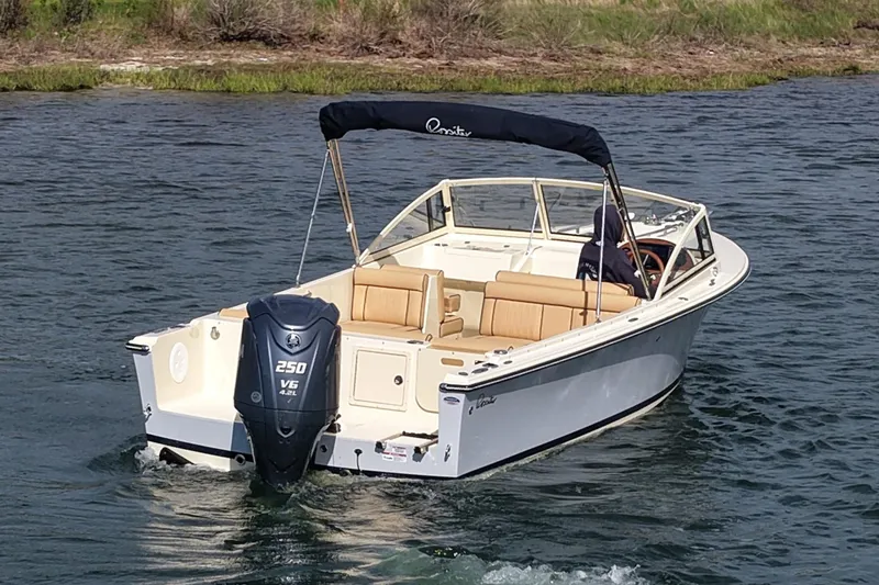 Slide: The Image of 2027 Rossiter 23 Closed Deck boat cruising on water with Yamaha 250 V6 engine. - 5