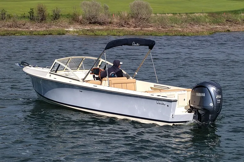 Slide: The Image of 2027 Rossiter 23 Closed Deck boat cruising on a lake with Yamaha 250 V6 engine. - 8