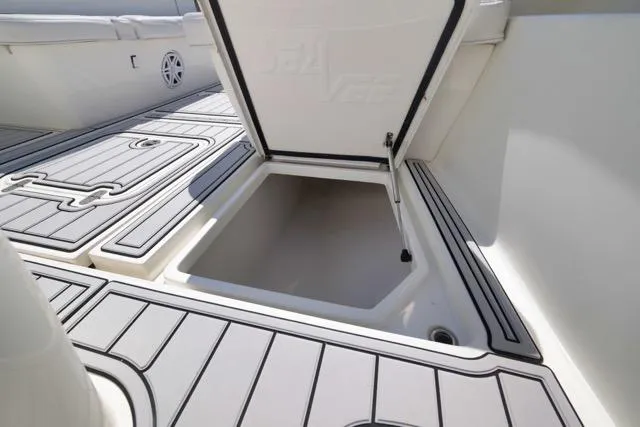 Slide: The Image of 2016 SeaVee 390 boat storage compartment with open hatch, showcasing spacious interior. - 41
