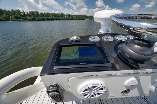 Slide: The Image of 2016 SeaVee 390 boat dashboard with Garmin navigation system on a sunny day. - 59