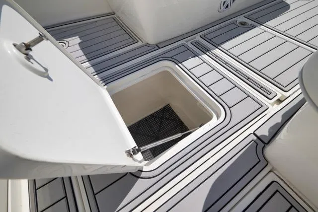 Slide: The Image of Open storage compartment on 2016 SeaVee 390 boat deck with non-slip flooring. - 40