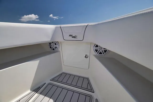Slide: The Image of 2016 SeaVee 390 boat interior with sleek white design and integrated speakers. - 35