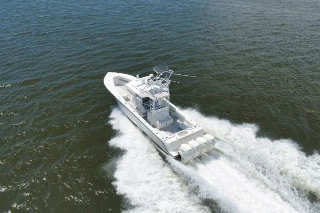 Slide: The Image of 2016 SeaVee 390 boat cruising on open water, showcasing powerful engines and sleek design. - 20