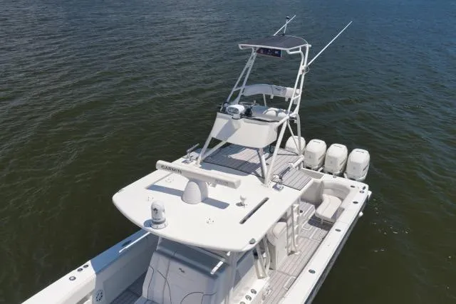 Slide: The Image of 2016 SeaVee 390 boat with tower and multiple outboard engines on open water. - 7