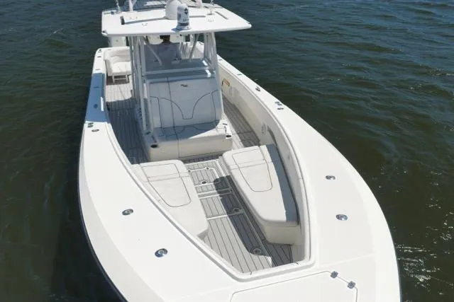 Slide: The Image of 2016 SeaVee 390 boat on water, featuring sleek design and spacious deck layout. - 10