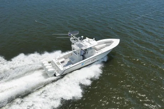 Slide: The Image of 2016 SeaVee 390 boat cruising on open water, aerial view. - 18