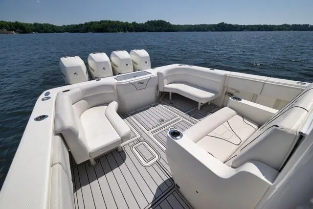 Slide: The Image of 2016 SeaVee 390 boat with spacious seating, four engines, and scenic lake view. - 47