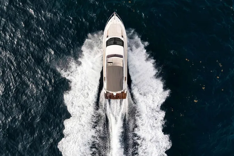 Slide: The Image of Aerial view of 2021 Ferretti Yachts 500 cruising through ocean waves. - 11