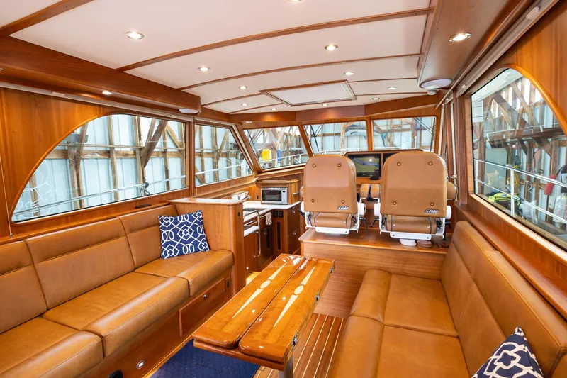 Slide: The Image of Luxurious interior of 2023 Sabre 45 Salon Express yacht with leather seating and wood finishes. - 14