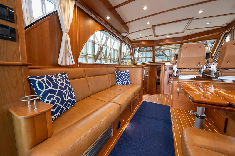 Slide: The Image of Luxurious interior of 2023 Sabre 45 Salon Express yacht with leather seating and nautical decor. - 15
