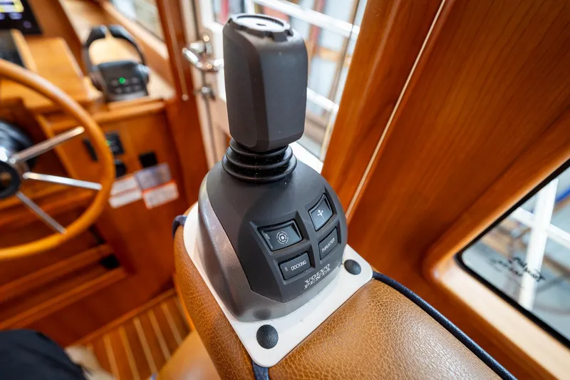 Slide: The Image of Joystick control on 2023 Sabre 45 Salon Express yacht, featuring advanced navigation buttons. - 20