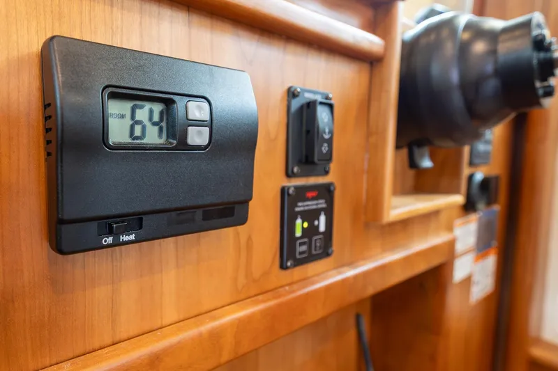 Slide: The Image of Thermostat and controls on 2023 Sabre 45 Salon Express yacht interior. - 21