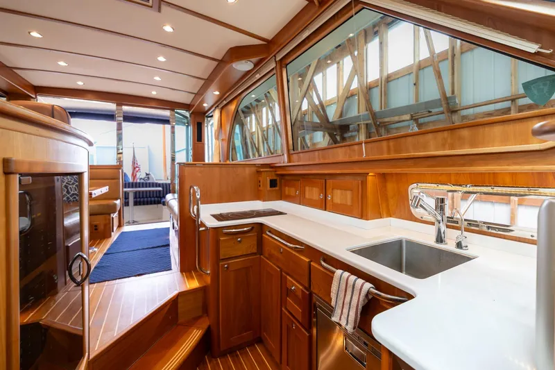 Slide: The Image of Luxurious interior of 2023 Sabre 45 Salon Express yacht with modern kitchen amenities. - 24