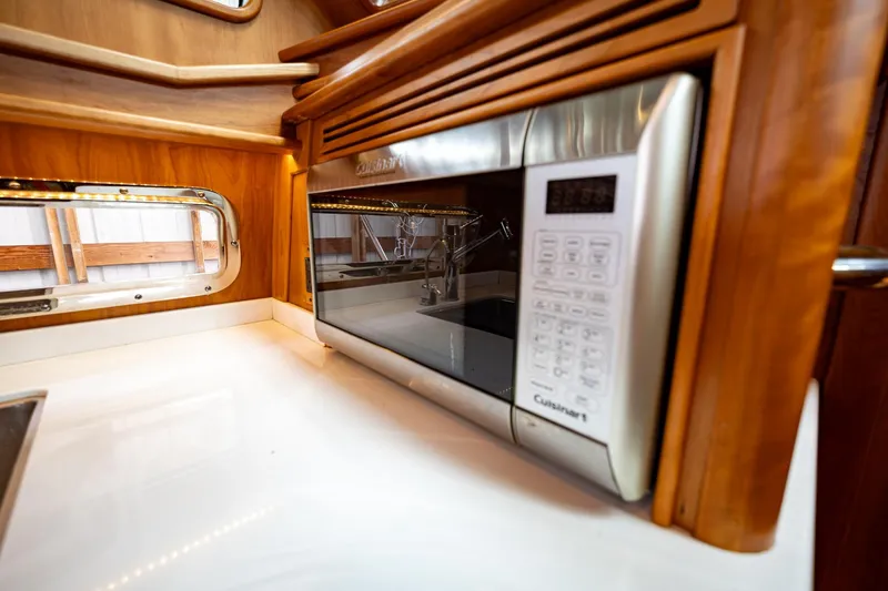 Slide: The Image of Modern kitchen interior of 2023 Sabre 45 Salon Express yacht with built-in microwave. - 26