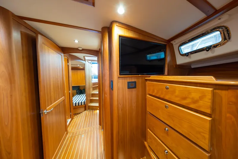 Slide: The Image of Interior of 2023 Sabre 45 Salon Express yacht with wooden cabinetry and modern amenities. - 28