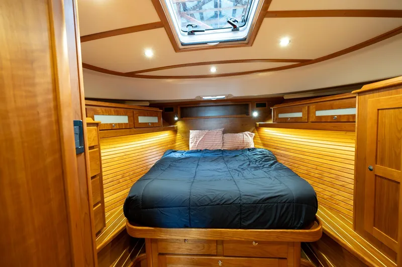 Slide: The Image of Luxurious 2023 Sabre 45 Salon Express cabin with wood paneling and skylight. - 29