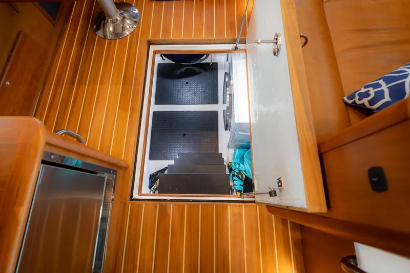 Slide: The Image of Interior view of 2023 Sabre 45 Salon Express, showcasing wooden flooring and open hatch. - 39