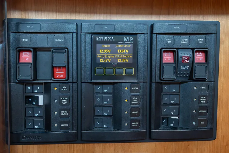 Slide: The Image of Electrical control panel on 2023 Sabre 45 Salon Express yacht, featuring Blue Sea Systems components. - 44