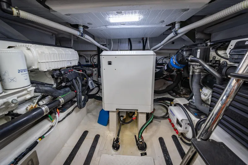 Slide: The Image of Engine room of 2023 Sabre 45 Salon Express yacht, showcasing advanced mechanical systems. - 47