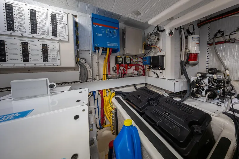 Slide: The Image of Engine room of 2023 Sabre 45 Salon Express, showcasing electrical panels and equipment. - 48