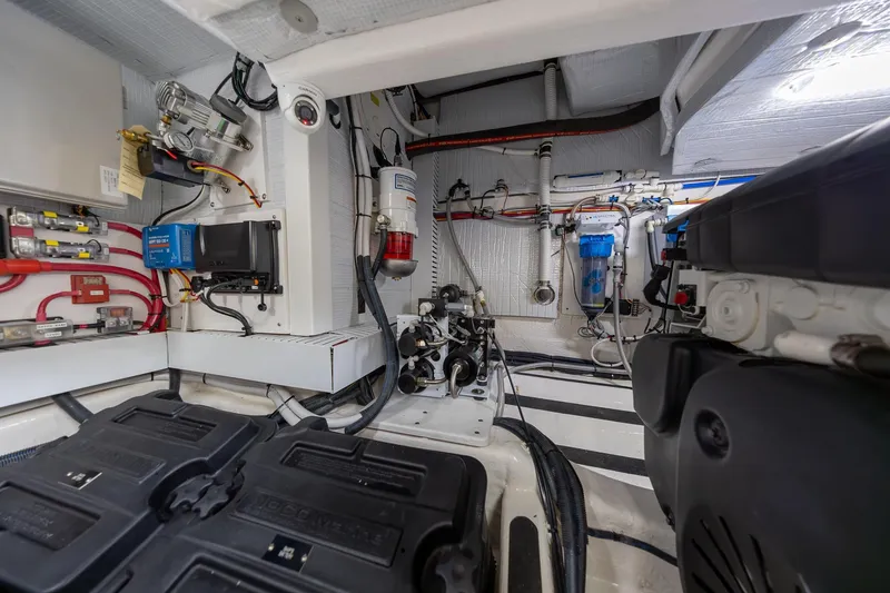 Slide: The Image of Engine room of 2023 Sabre 45 Salon Express, showcasing advanced mechanical systems and wiring. - 49