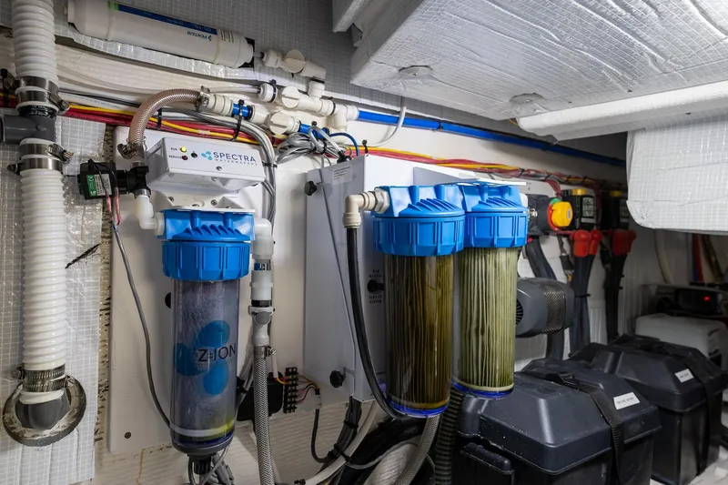 Slide: The Image of Engine room of 2023 Sabre 45 Salon Express with water filtration system. - 50