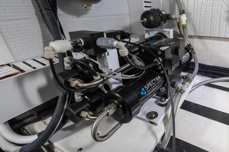 Slide: The Image of Engine room of 2023 Sabre 45 Salon Express featuring Spectra watermaker system. - 51