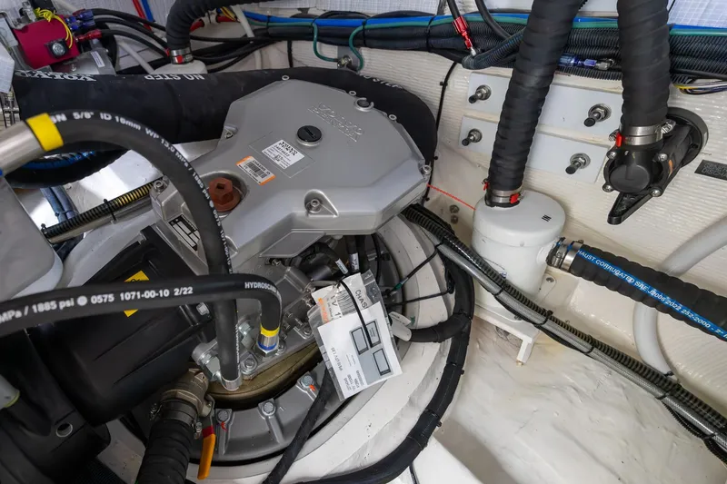 Slide: The Image of Engine compartment of 2023 Sabre 45 Salon Express, showcasing detailed mechanical components and wiring. - 54