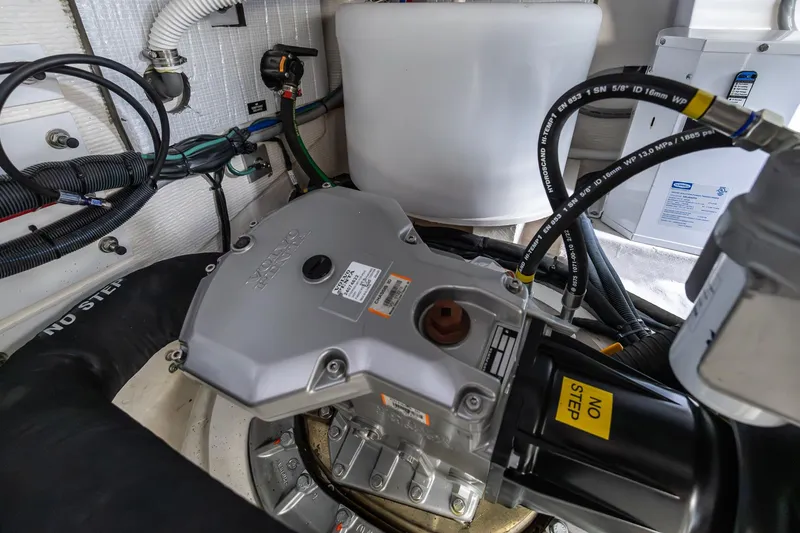 Slide: The Image of Engine compartment of 2023 Sabre 45 Salon Express with visible wiring and components. - 55