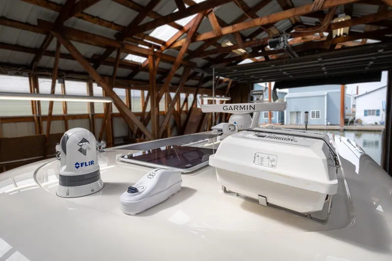 Slide: The Image of 2023 Sabre 45 Salon Express yacht with advanced Garmin and FLIR navigation equipment. - 59