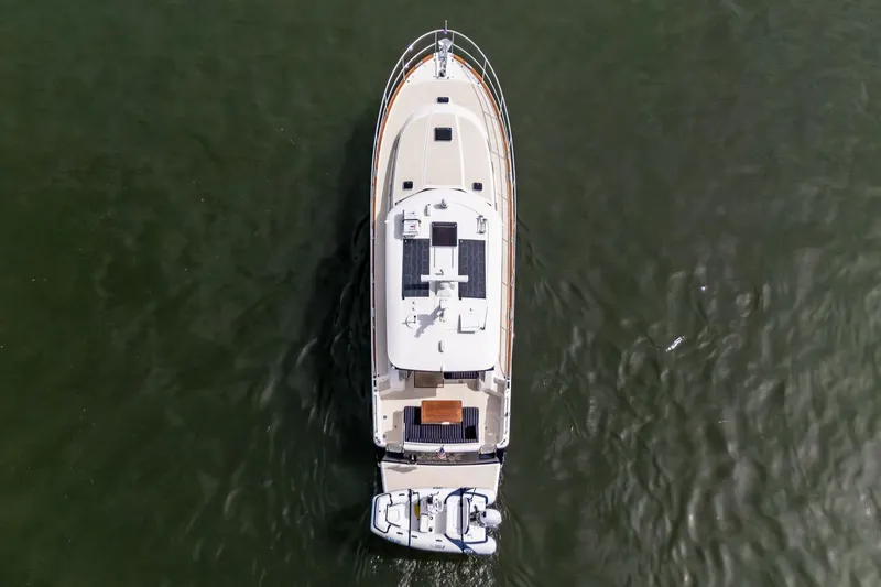 Slide: The Image of Aerial view of 2023 Sabre 45 Salon Express yacht cruising on water. - 6