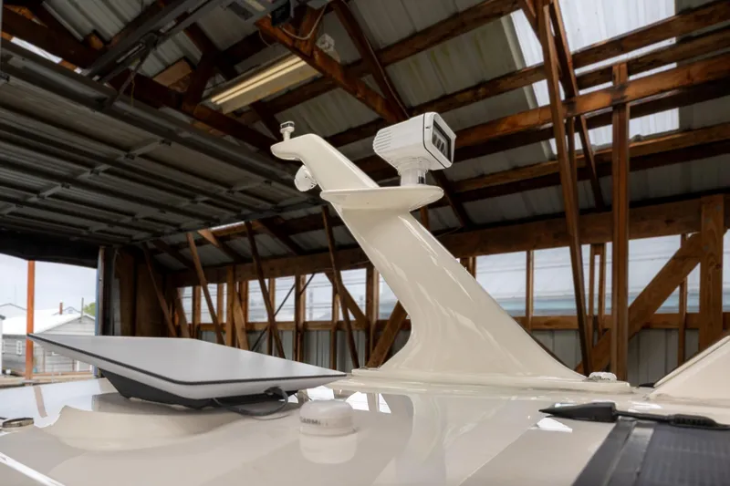 Slide: The Image of 2023 Sabre 45 Salon Express radar and satellite equipment in a boat shed. - 63