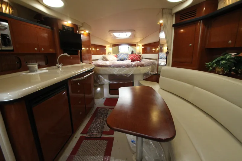 Slide: The Image of Luxurious interior of 2005 Sea Ray 340 Sundancer yacht with elegant wood finishes. - 18