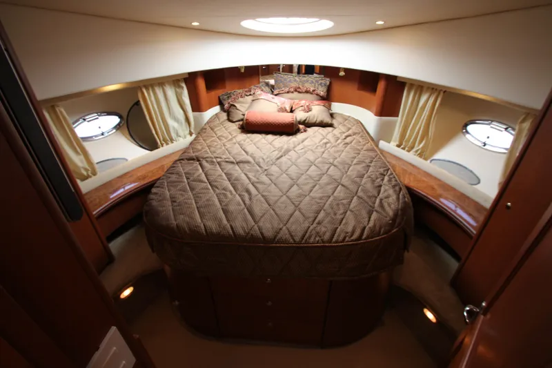 Slide: The Image of Luxurious cabin interior of a 2006 Silverton 38 Sport Bridge yacht with plush bedding. - 14