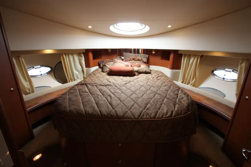 Slide: The Image of Luxurious cabin interior of 2006 Silverton 38 Sport Bridge yacht with cozy bedding. - 15