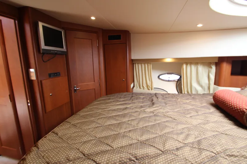 Slide: The Image of Luxurious cabin interior of 2006 Silverton 38 Sport Bridge yacht with cozy bedding. - 16