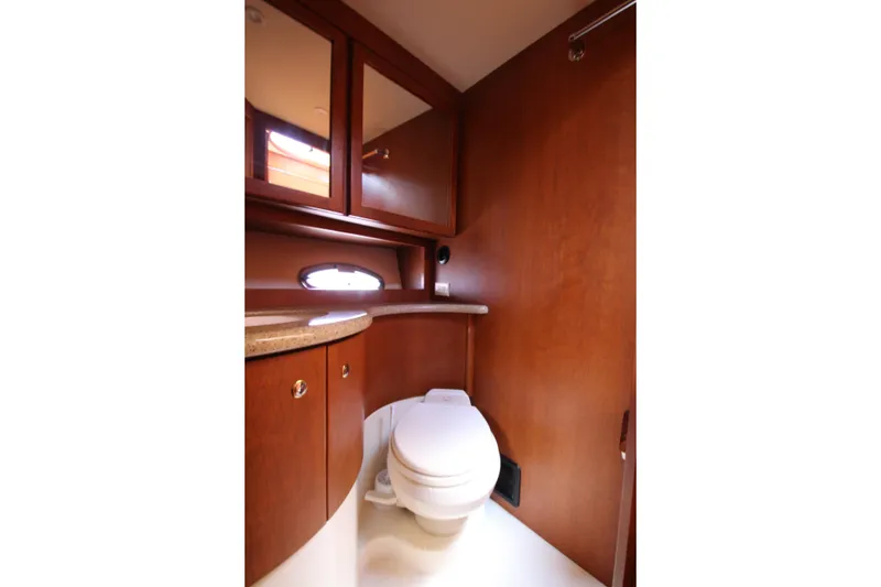 Slide: The Image of Luxurious bathroom interior of 2006 Silverton 38 Sport Bridge yacht with wooden cabinetry. - 18