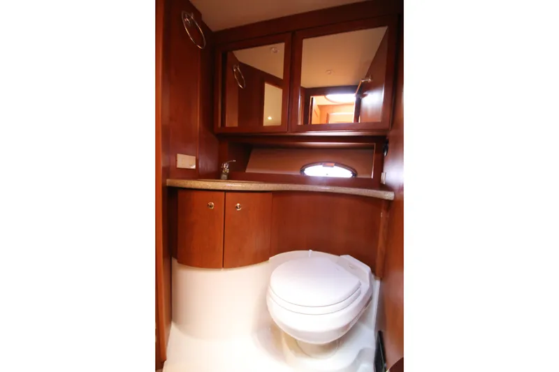 Slide: The Image of Luxurious bathroom interior of 2006 Silverton 38 Sport Bridge yacht with wooden cabinetry. - 19