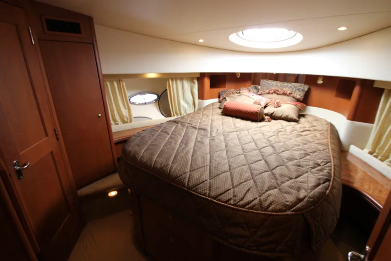 Slide: The Image of Luxurious cabin interior of 2006 Silverton 38 Sport Bridge yacht with cozy bedding. - 21