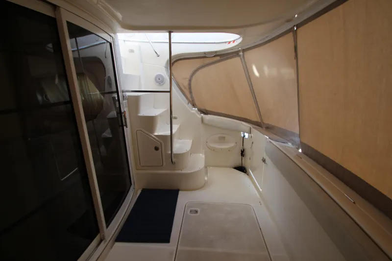 Slide: The Image of 2006 Silverton 38 Sport Bridge interior with stairs and enclosed deck area. - 31