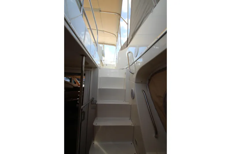 Slide: The Image of Staircase on 2006 Silverton 38 Sport Bridge yacht, leading to upper deck. - 32