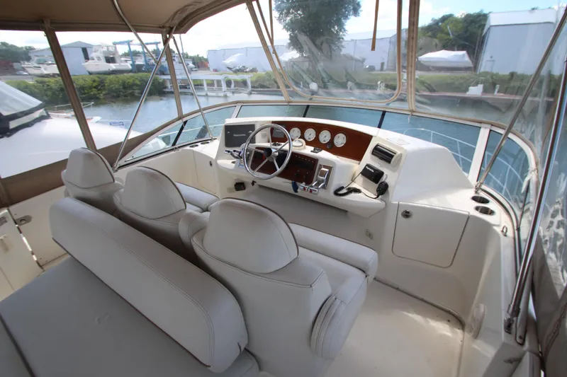 Slide: The Image of 2006 Silverton 38 Sport Bridge helm with modern controls and comfortable seating. - 33